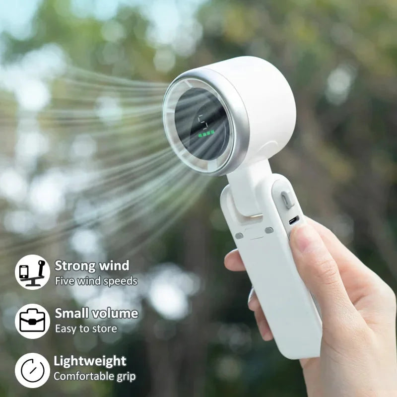 "Mini turbo fan with LCD display, perfect for travel and desk use."